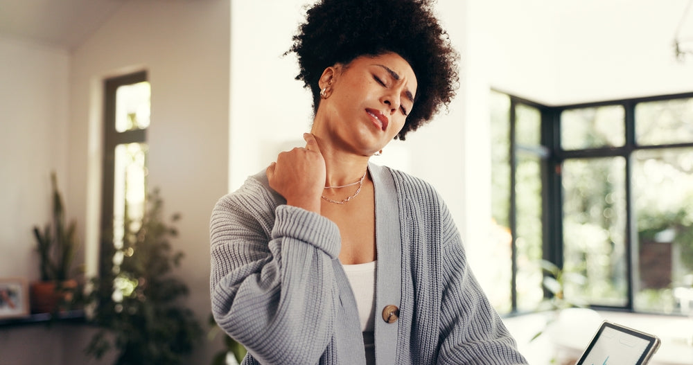 Woman dealing with chronic stress and neck tension