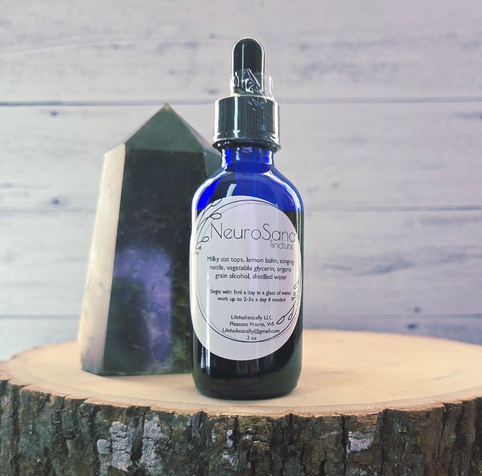 Close up of Lifeholistically’s NeuroSana tincture featuring milky oats, lemon balm, and nettle.
